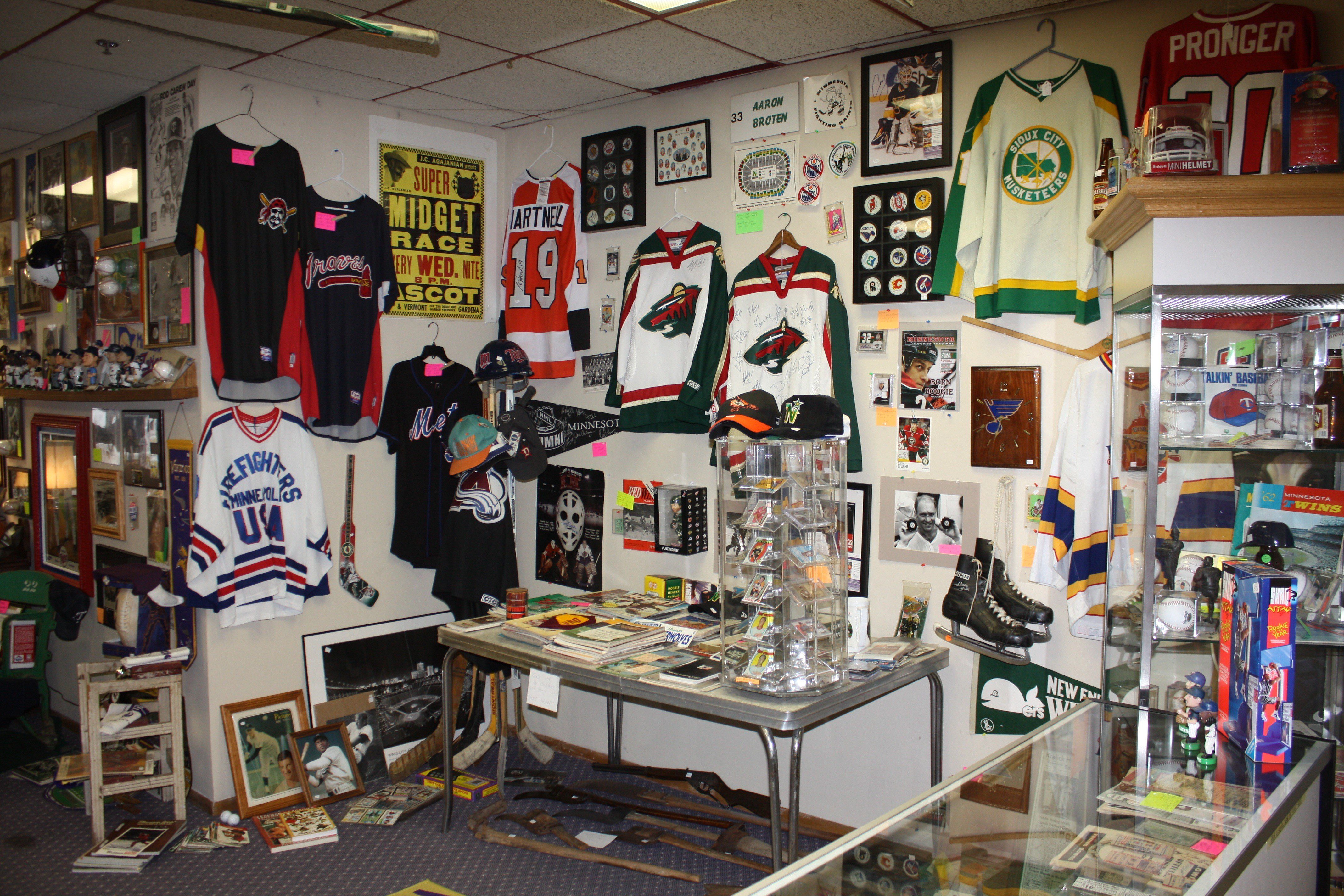 wall of sports jerseys and trading cards - Kyle's Kollectibles