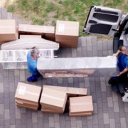 KylesKollectibles-liquidation-120520251 movers transporting boxes into a truck - Kyle's Kollectibles liquidation