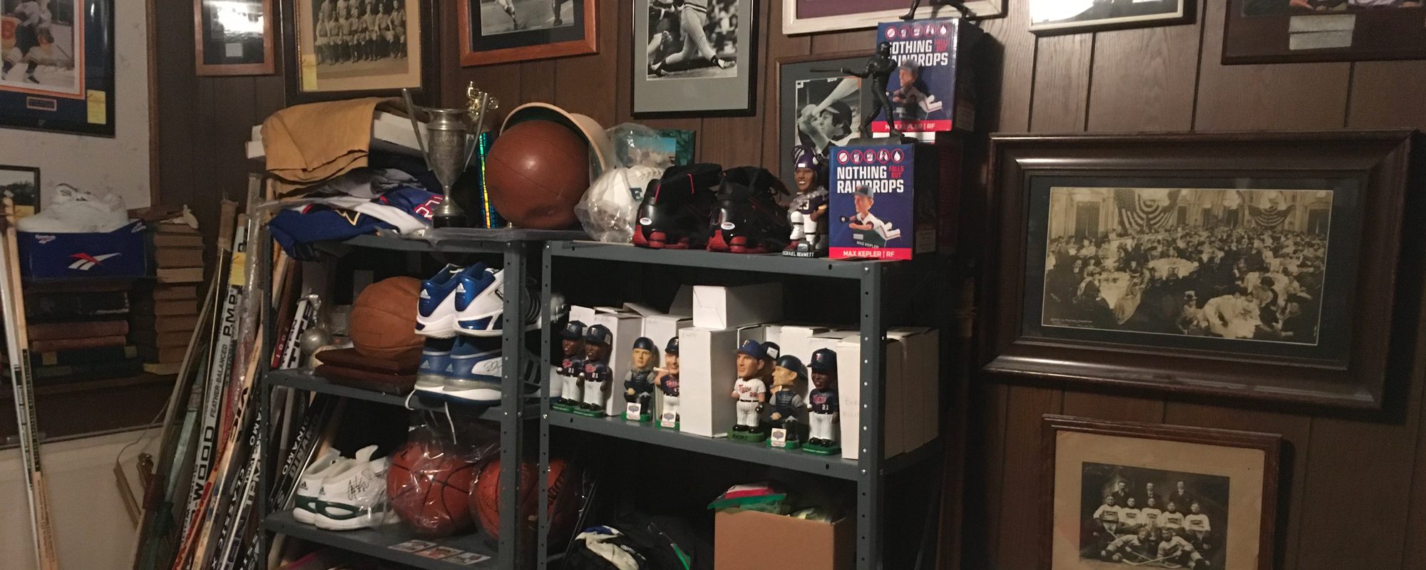 metal shelves with vintage sports equipment and bobble heads - Kyle's Kollectibles