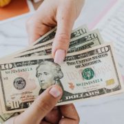 KylesKollectibles-buying-process-120420251 two hands exchanging American currency - Kyle's Kollectibles buying process