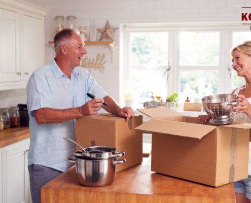 older man and woman packing up their kitchen - Kyle's Kollectibles house clearing & liquidation
