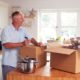 older man and woman packing up their kitchen - Kyle's Kollectibles house clearing & liquidation